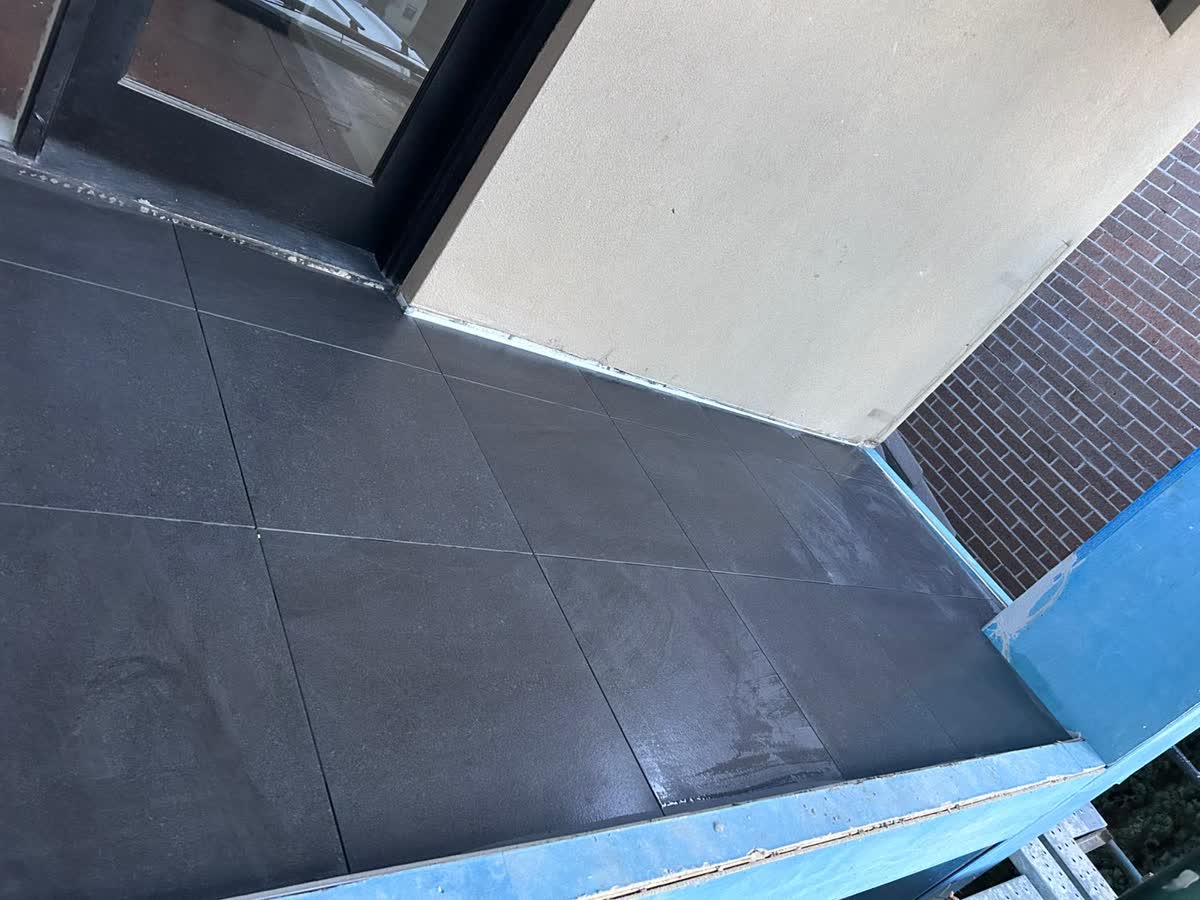 Finished balcony with large grey tiles