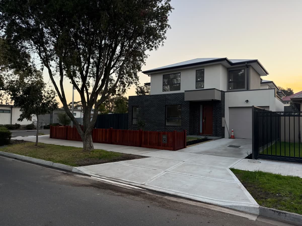 Finished townhouse on the corner, with a new footpath and crossover
